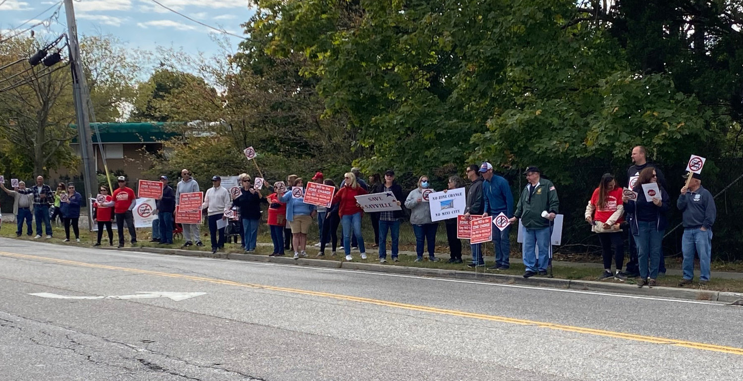 Over 100 protestors attended the Greater Islip Association’s event to express their opposition to a proposed zone change at the former Island Hills Golf Course by current owner of the property, Rechler Equity Company.